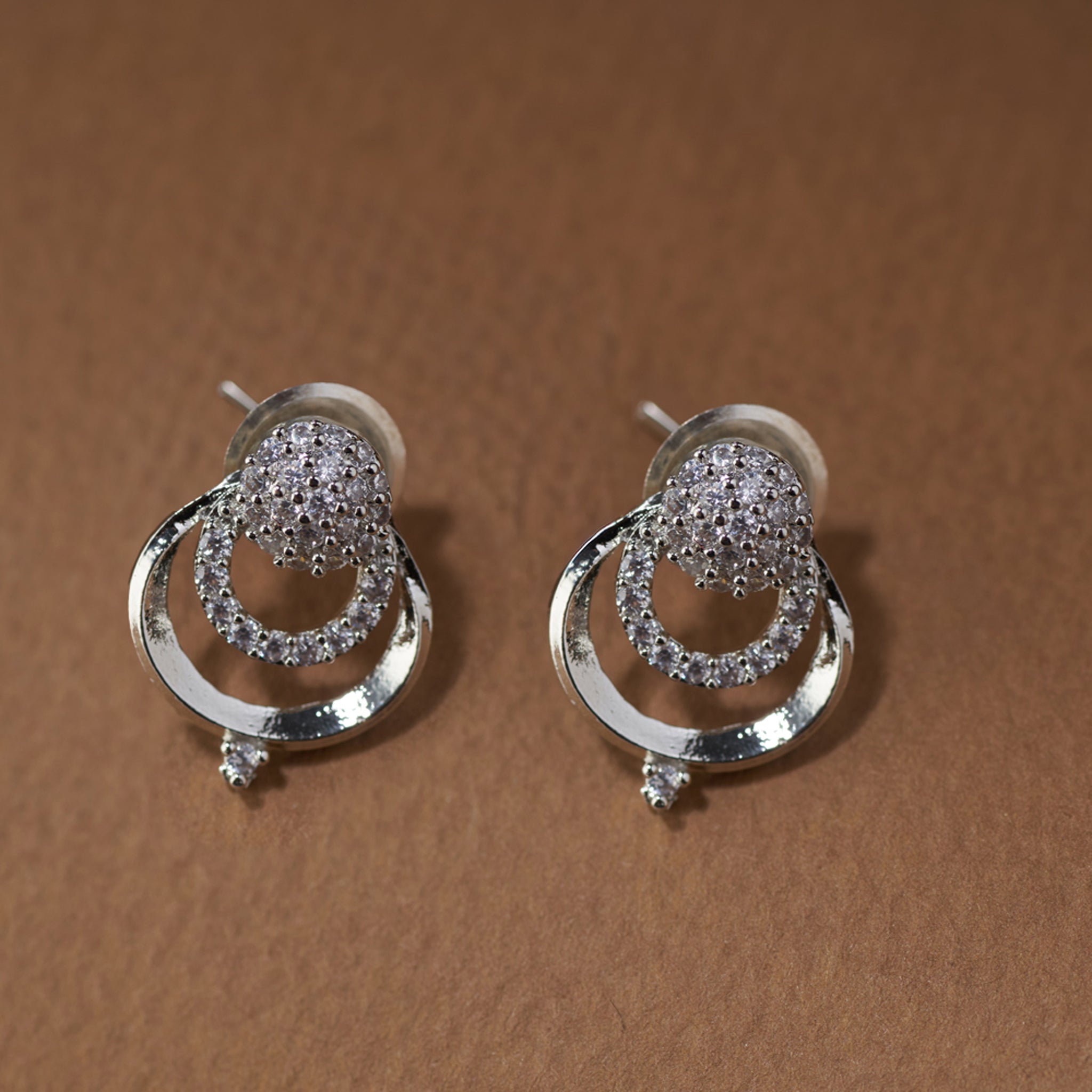 Silver-tone CZ necklace with intricate floral detailing and matching stud earrings