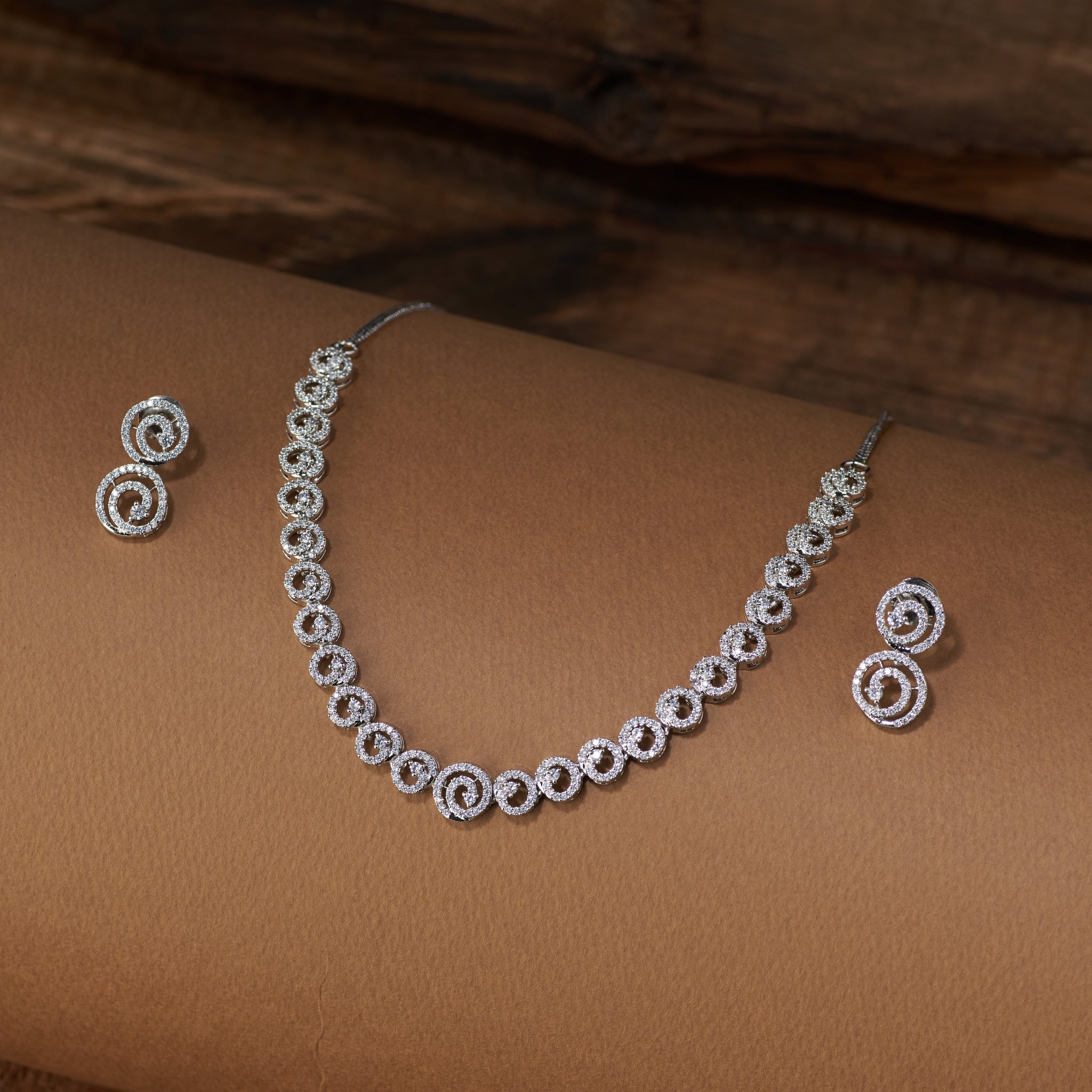 Silver plated zircon necklace and earrings. American diamond radiant swirl by Tilloma.