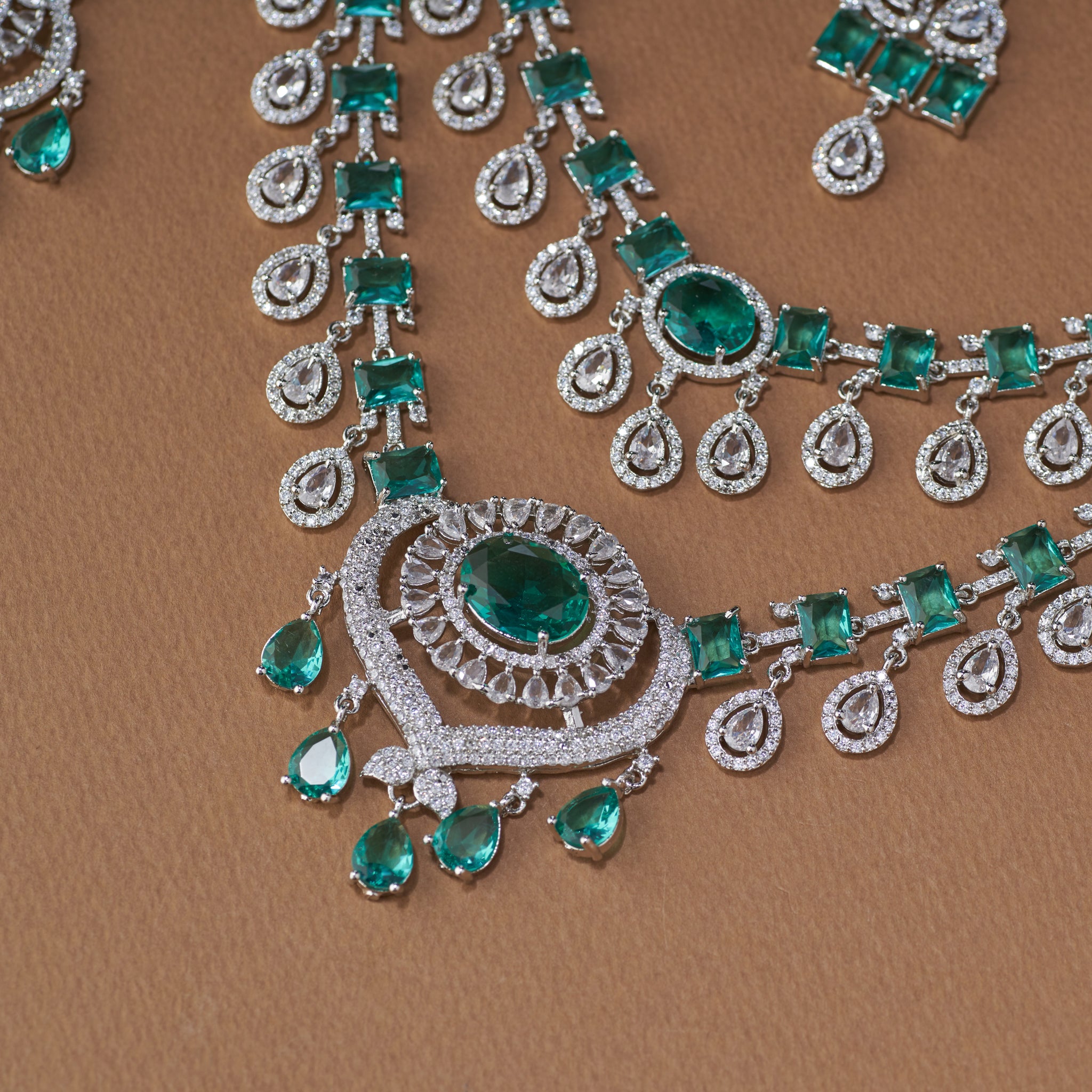:Elegant emerald and American diamond bridal necklace set with matching long earrings