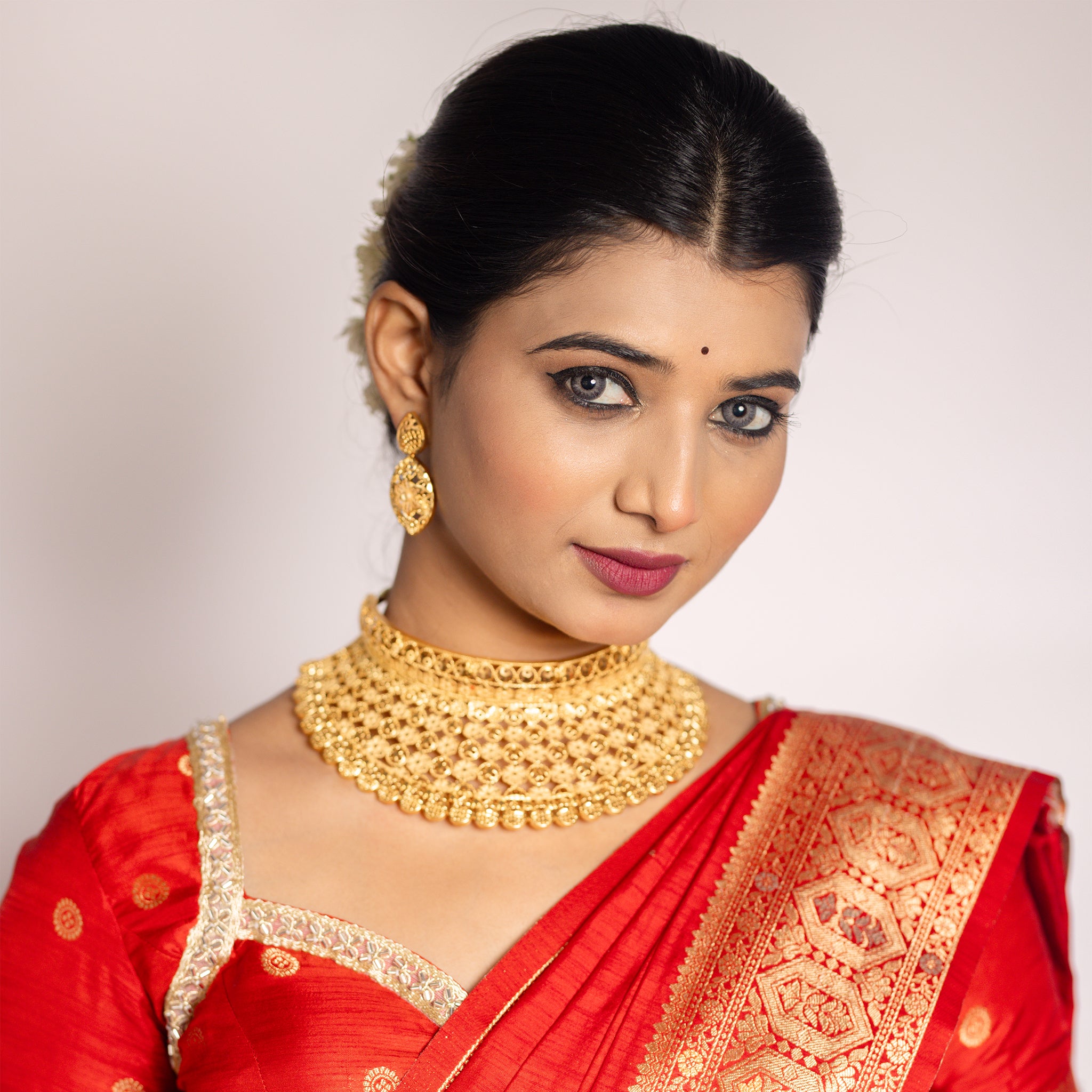 Woman wearing gold choker replica jewelry. Gold Choker, Bridal set, Divyashri By Tilloma