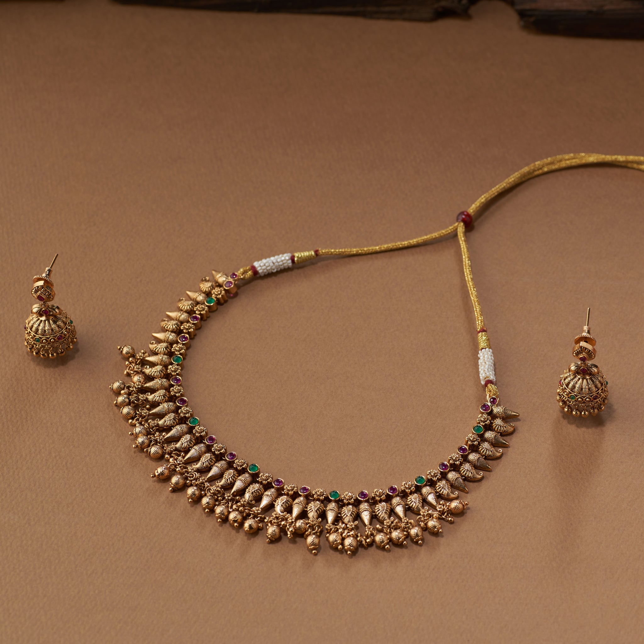 South Indian temple jewellery set with high-gold kasu necklace and jhumka earrings.