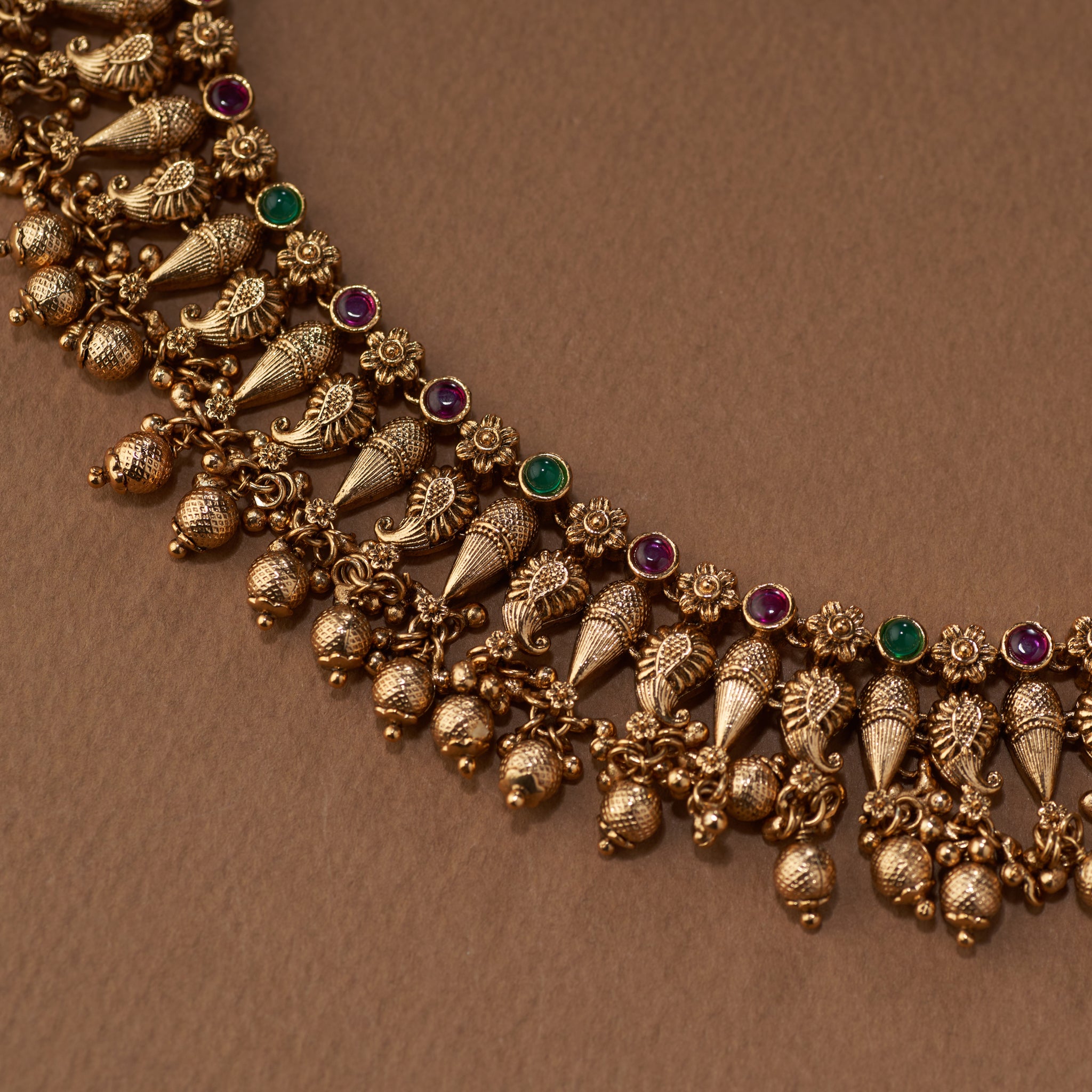 South Indian temple jewellery set with high-gold ganeshakasu necklace and jhumka earrings.