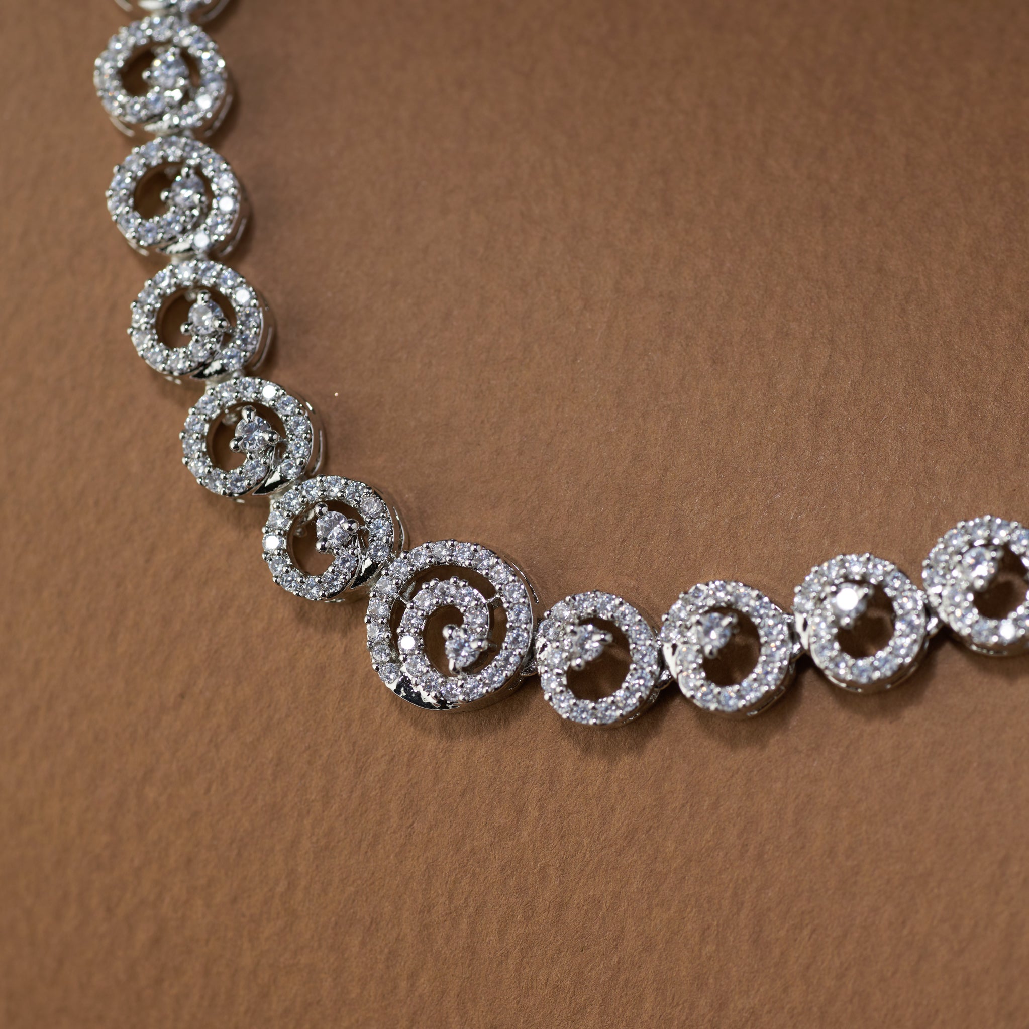 Silver plated zircon necklace and earrings. American diamond  radiant swirl by Tilloma.