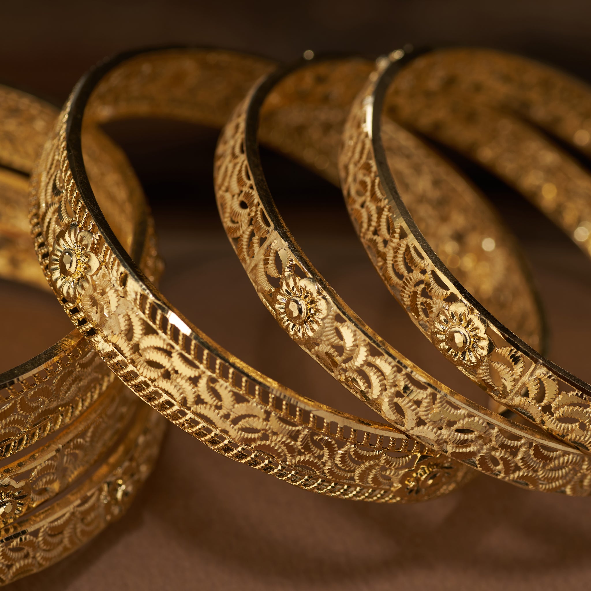 Gold forming replica bangles set of 6 with intricate lattice floral design – traditional jewellery for weddings, parties, and festive occasions.